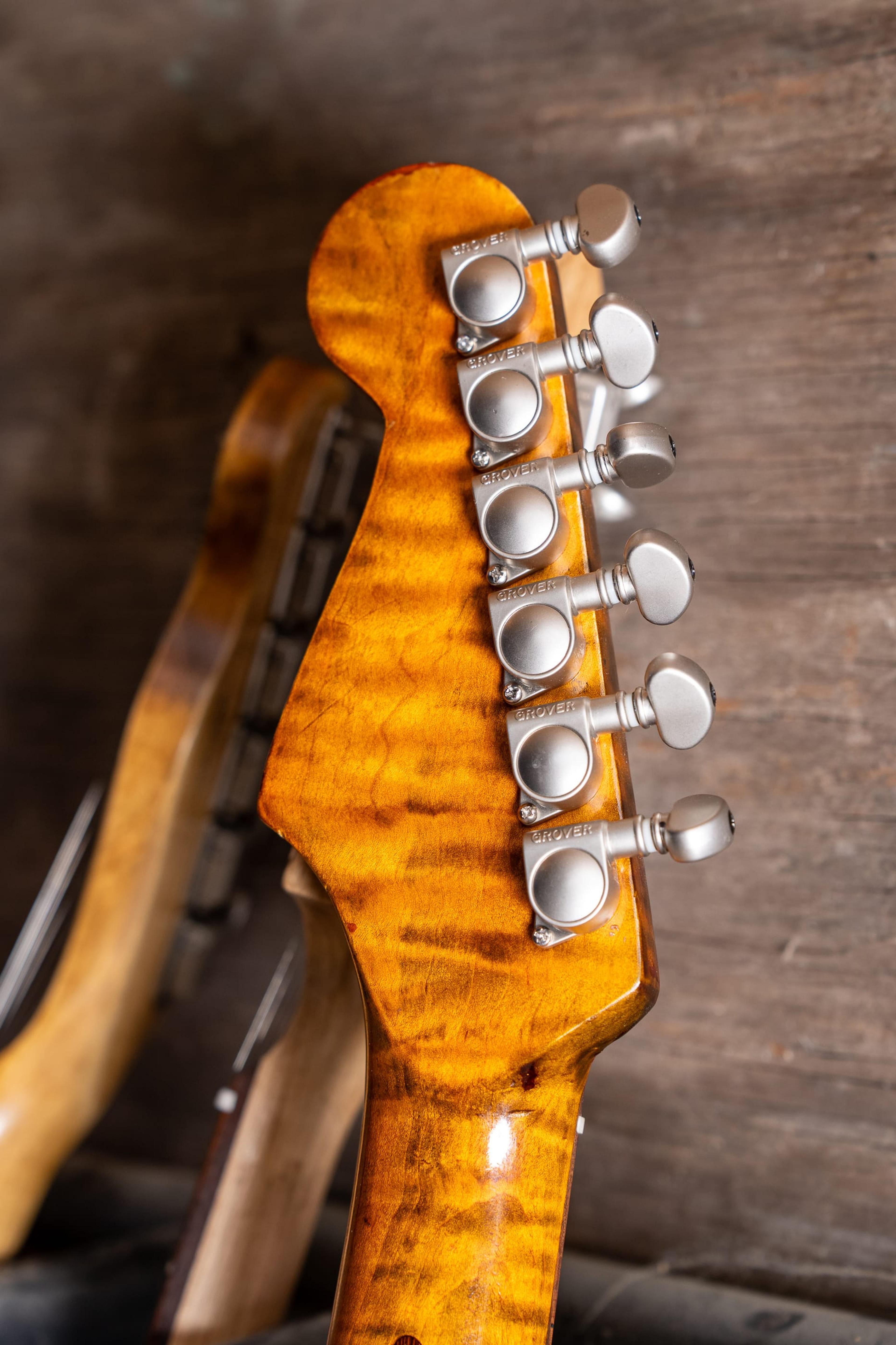 The back of the DeVille's flame maple headstock