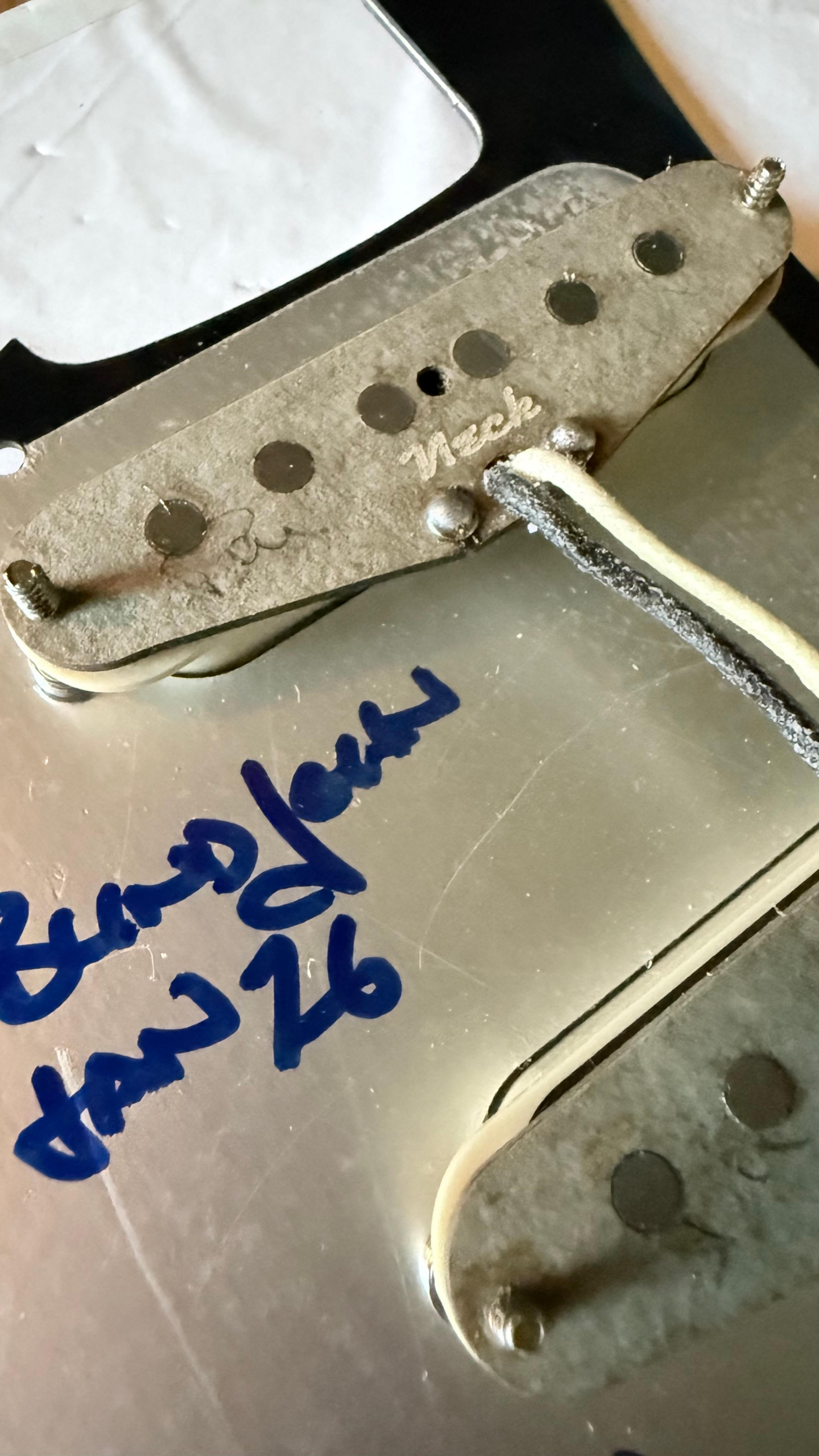 The neck pickup from behind, over John's signature on the shielding