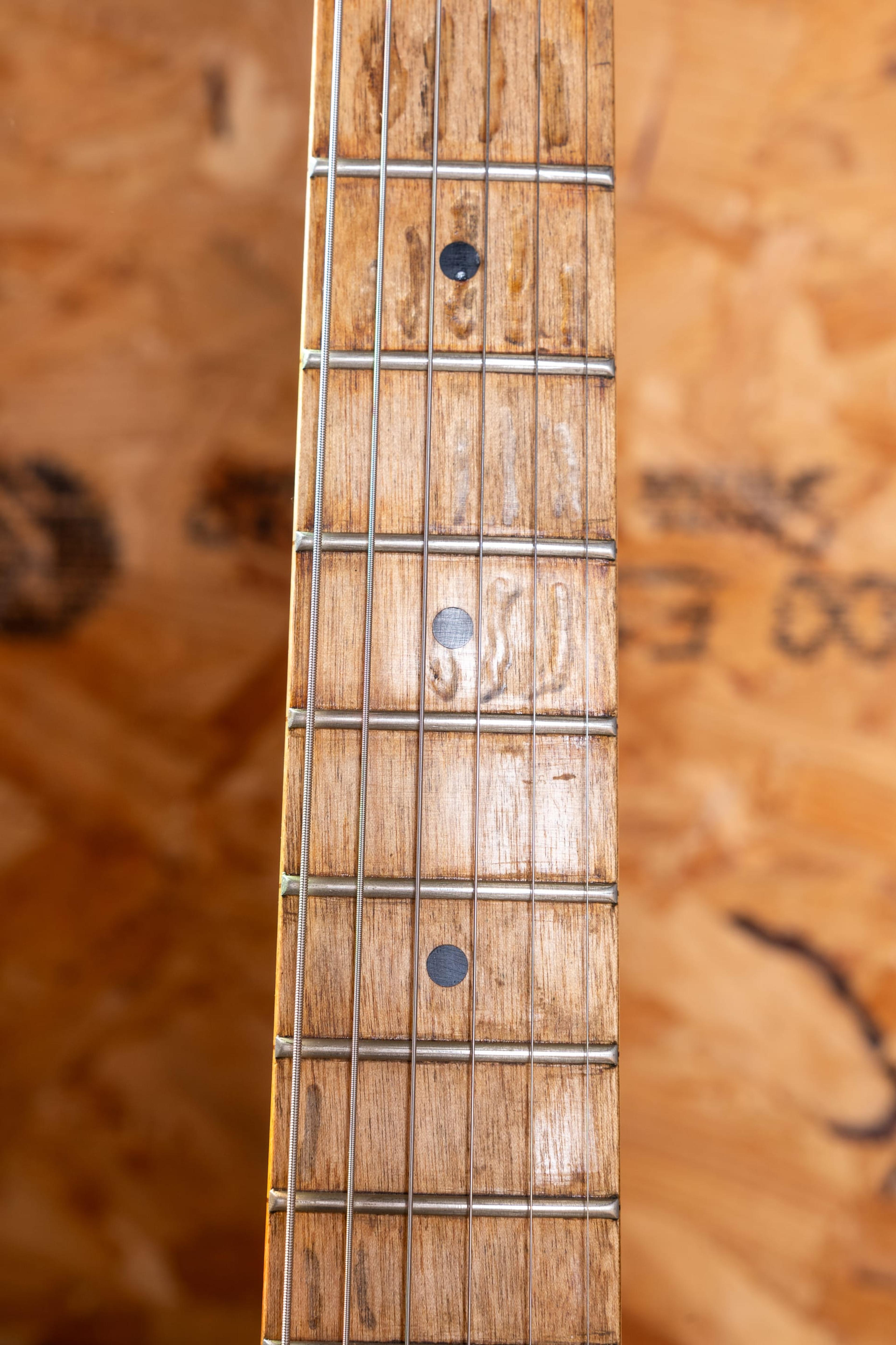 The Runaway's worn maple board and mother-of-pearl dots