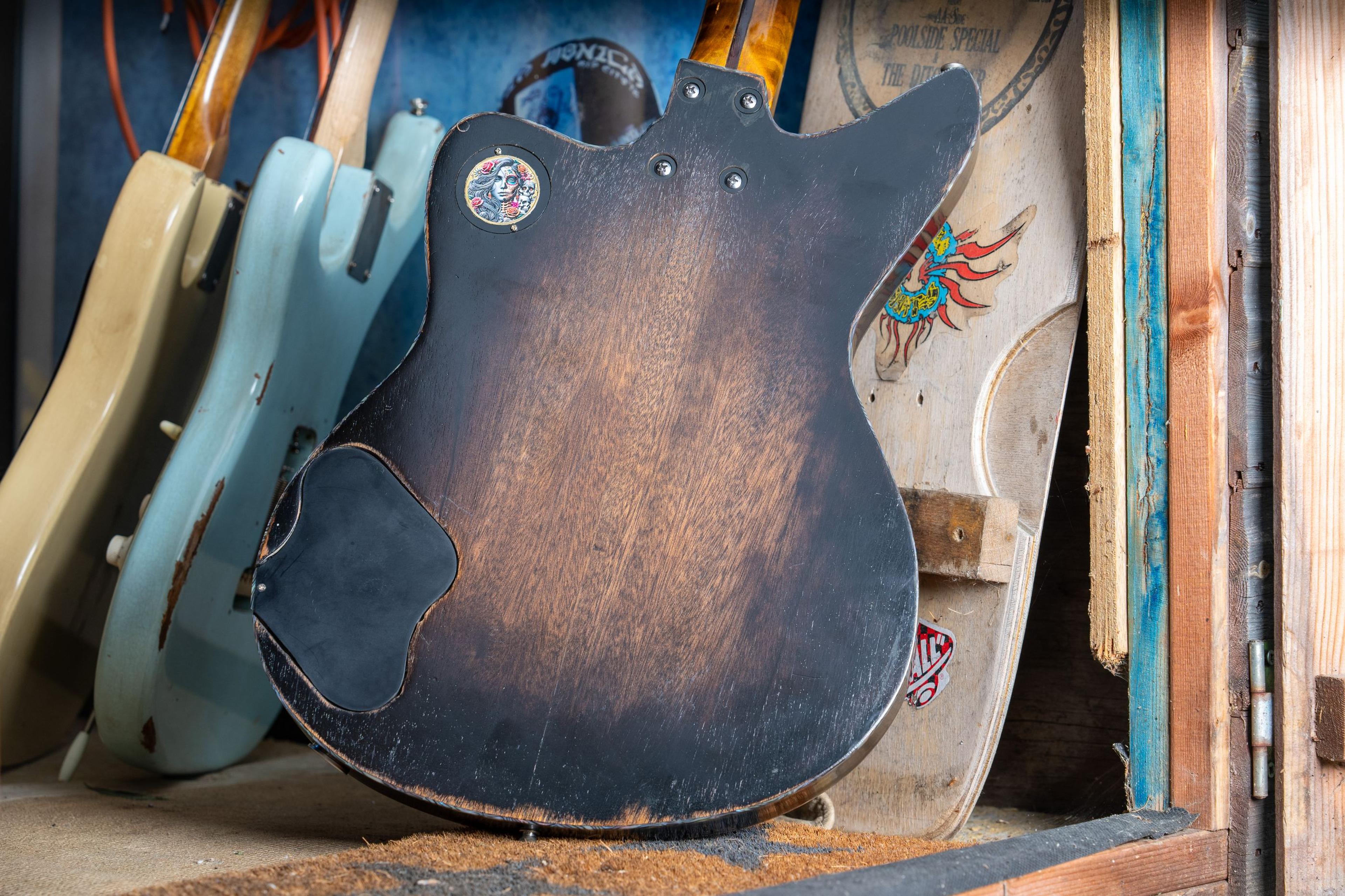 The back of the DeVille, the nitro worn through to the wood