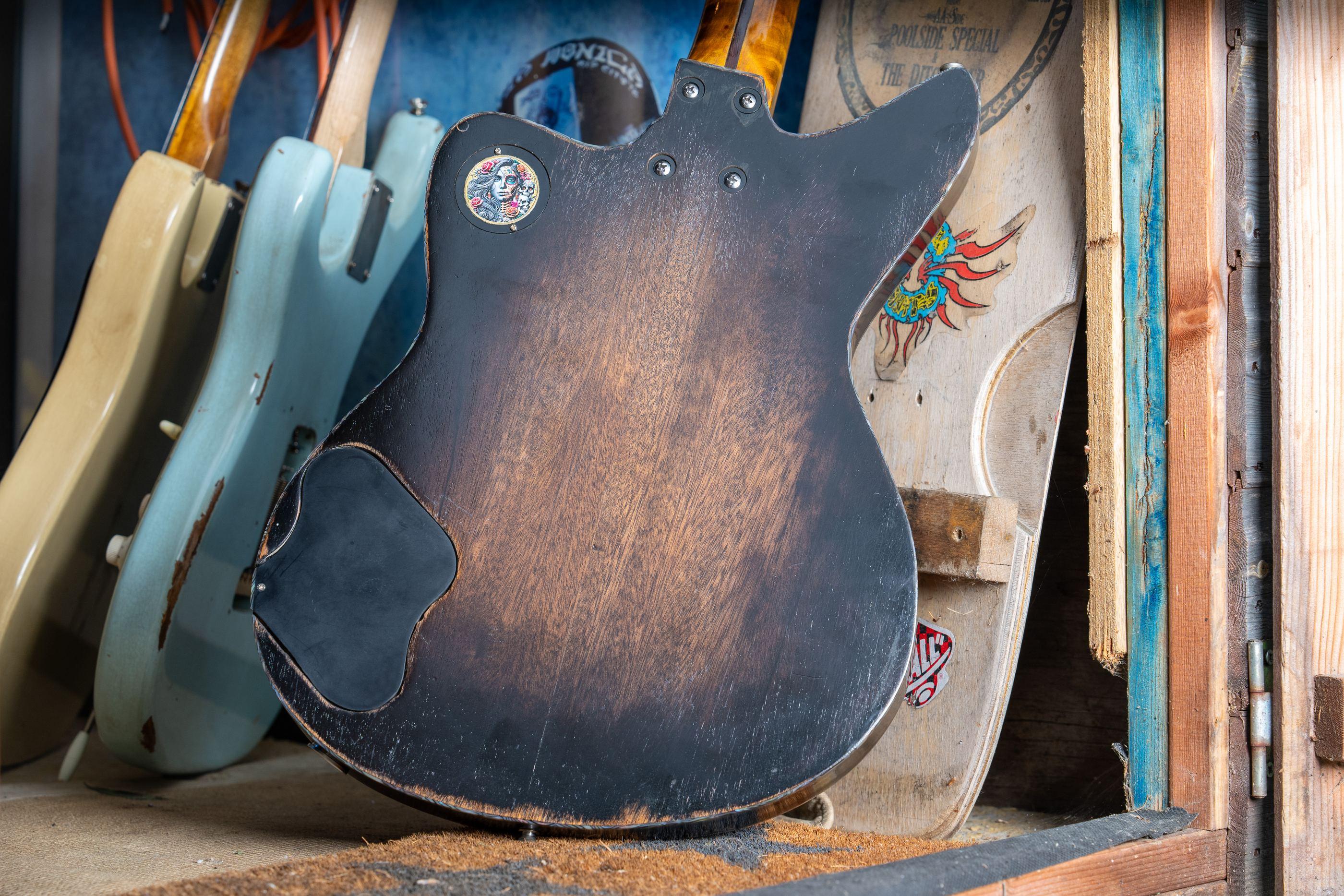 The back of the DeVille, the nitro worn through to the wood