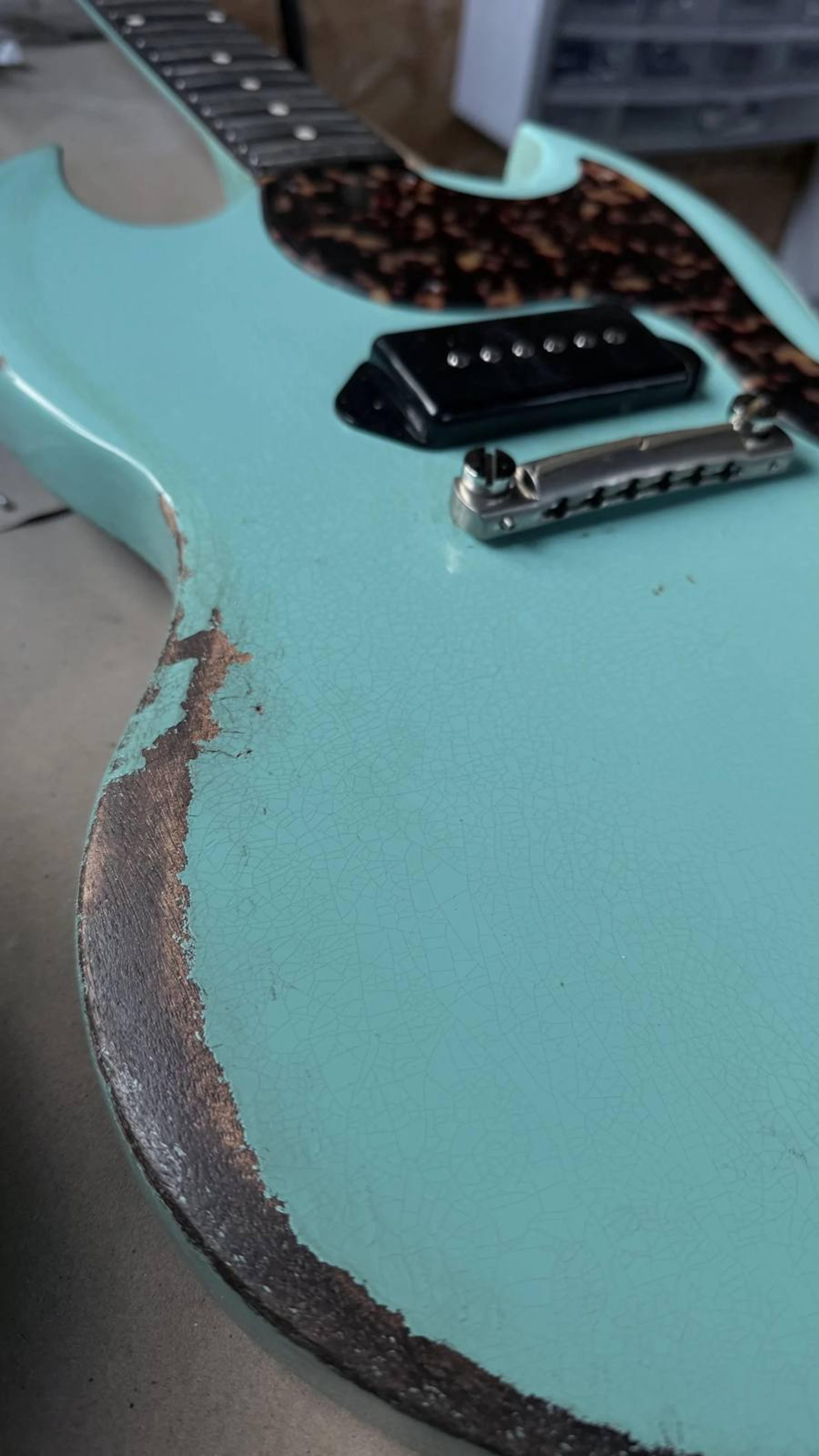 The Kid - SG Jnr style double cut - set neck - relic surf green with Tort celluloid acetate hand cut pickguard - Thomas Nilsen Dog Ear P90 arm relic detail