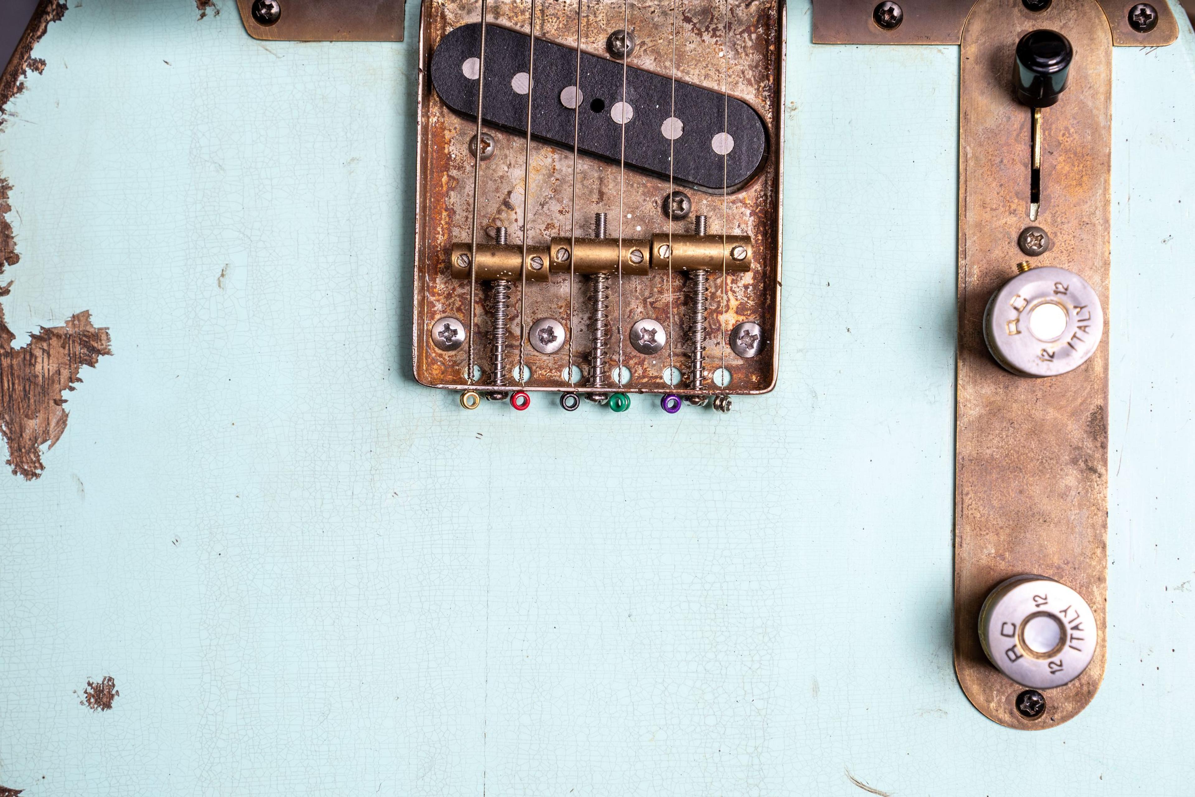 The Tele's bridge plate, the sonic blue chipped round it