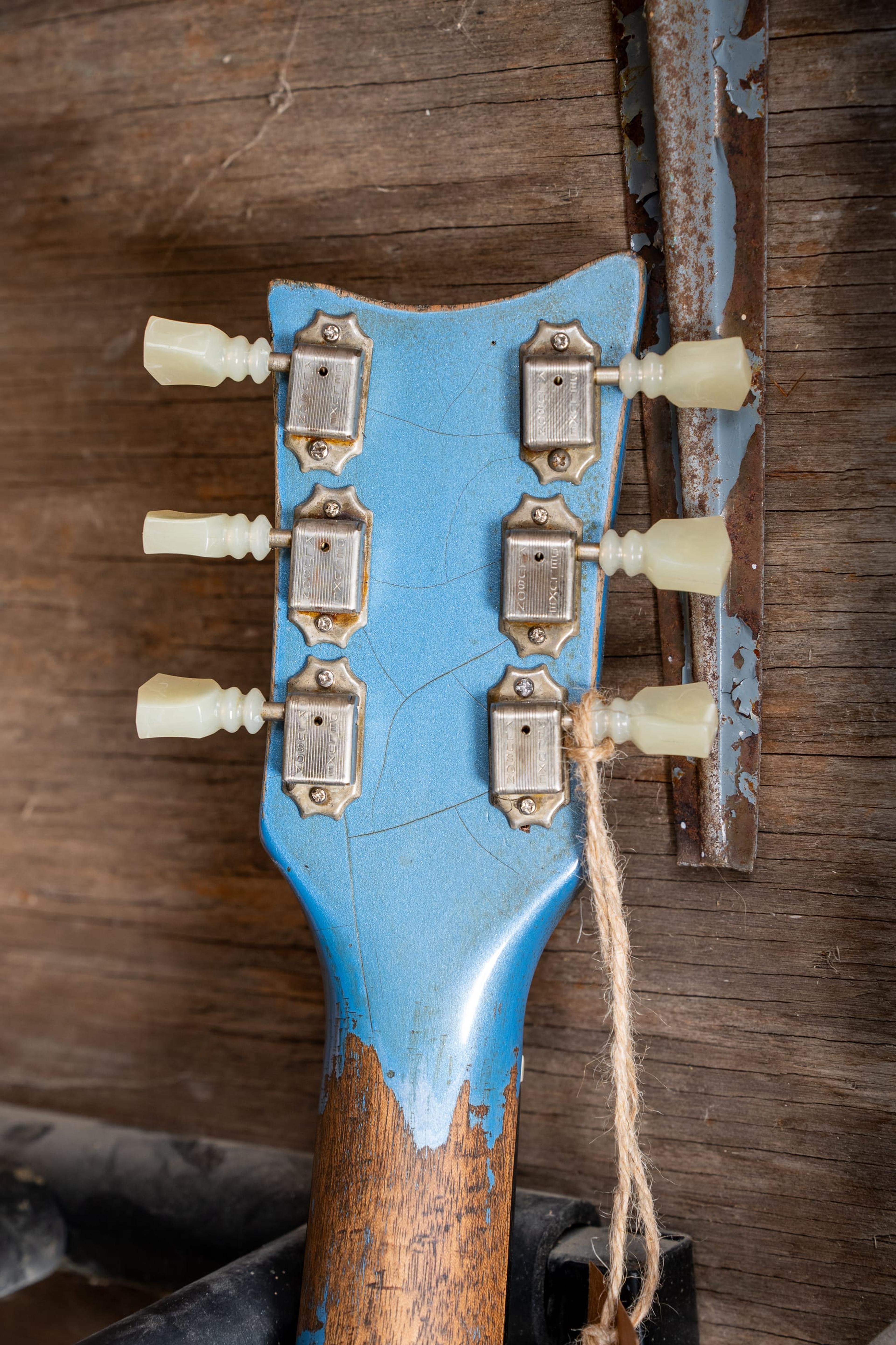 The back of the Rebel's headstock and the neck's bare wood