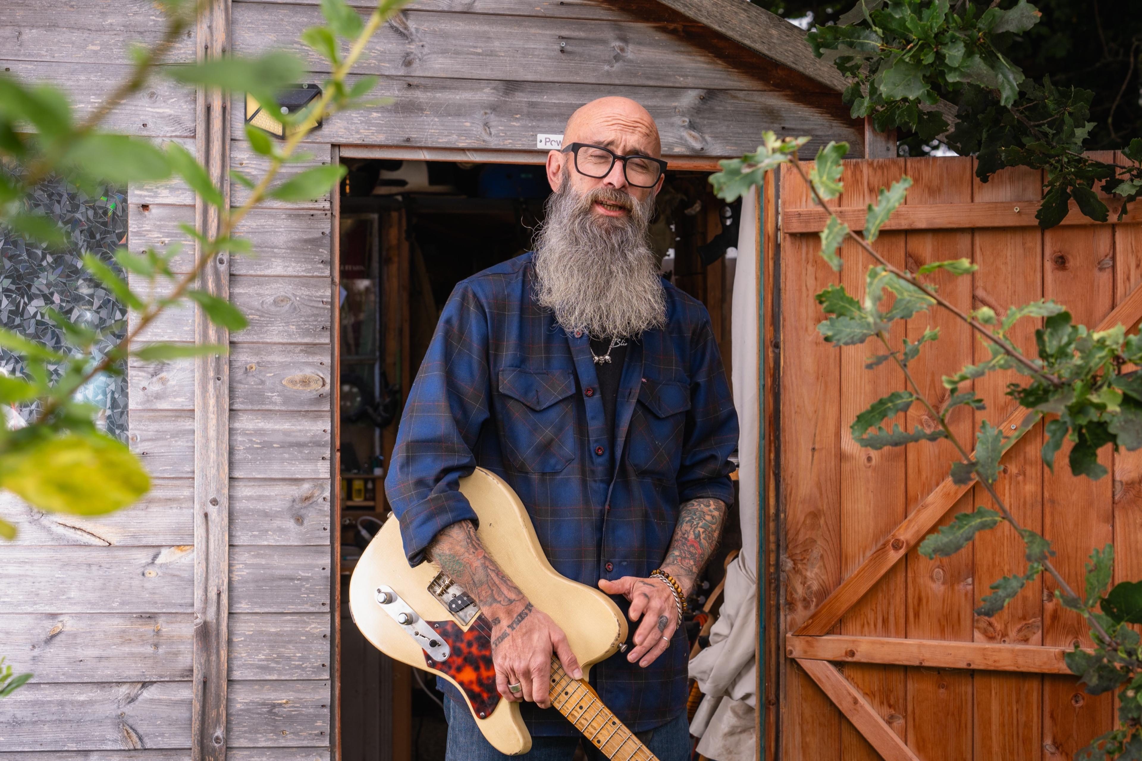 John at the shed door with a relic'd blonde Telecaster