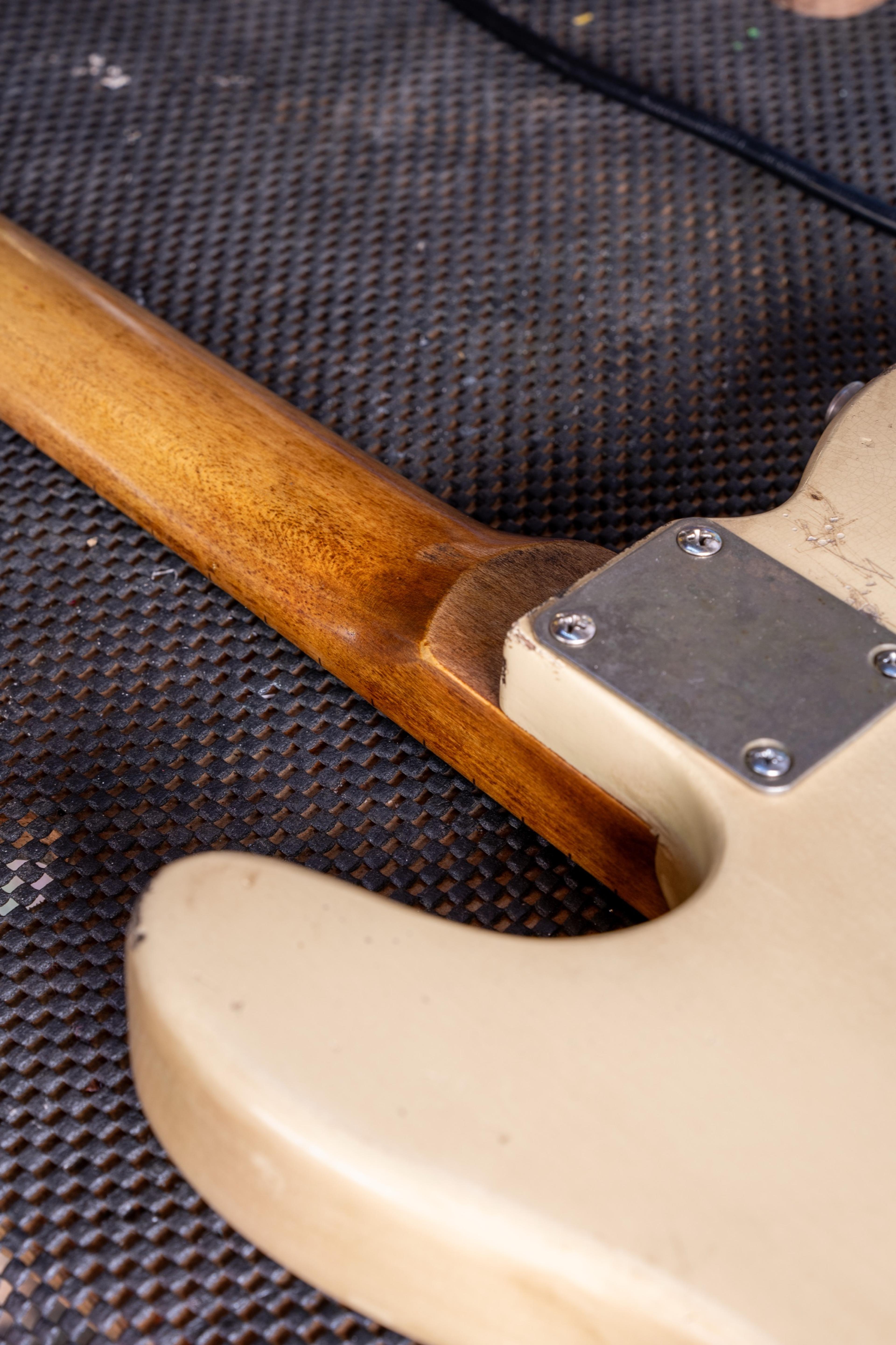The neck heel and plate of the blonde Telecaster, the lacquer worn off the maple