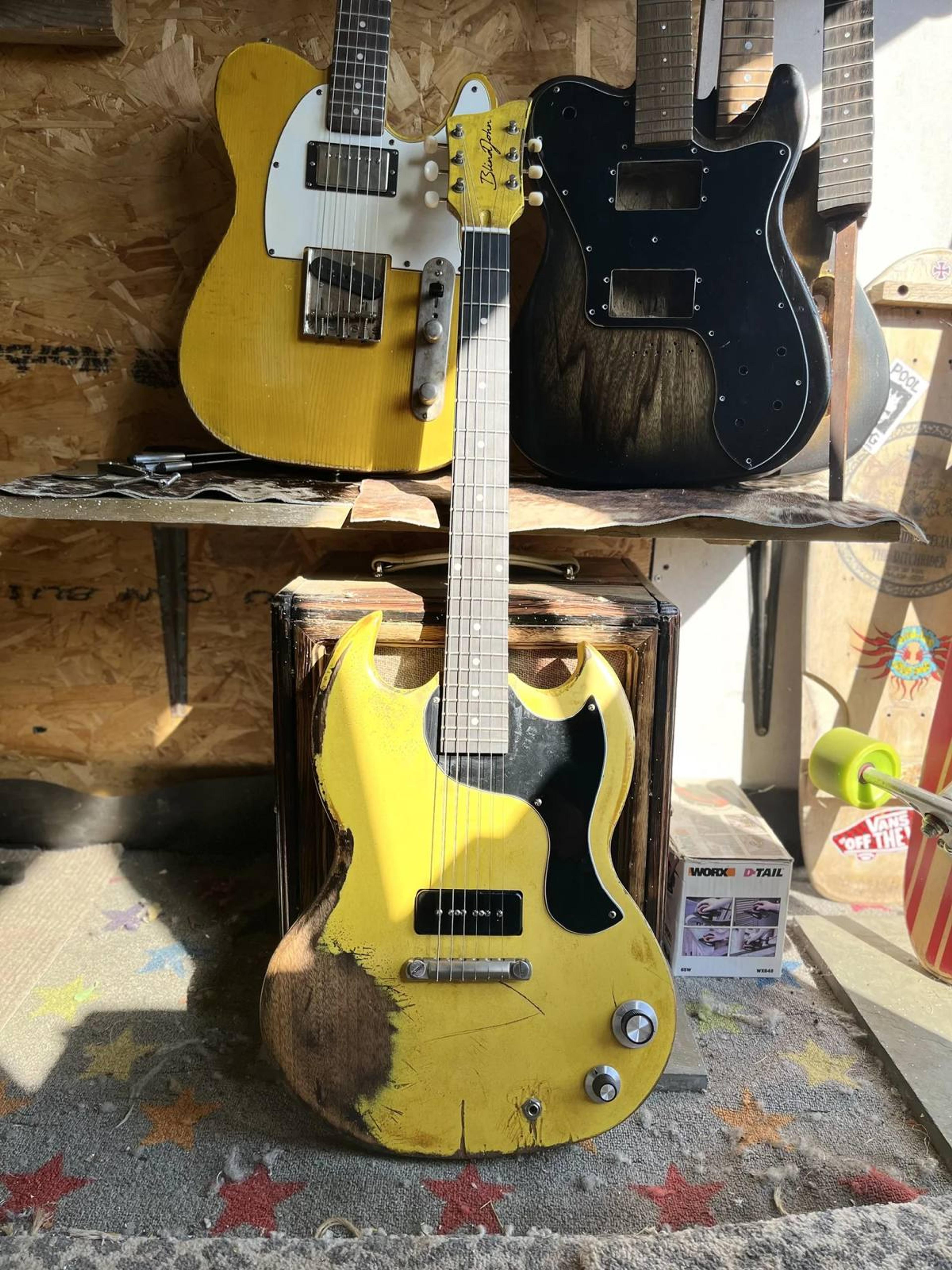The Kid - SG Jnr style double cut - set neck - relic guitar in Positano Yellow workshop sun