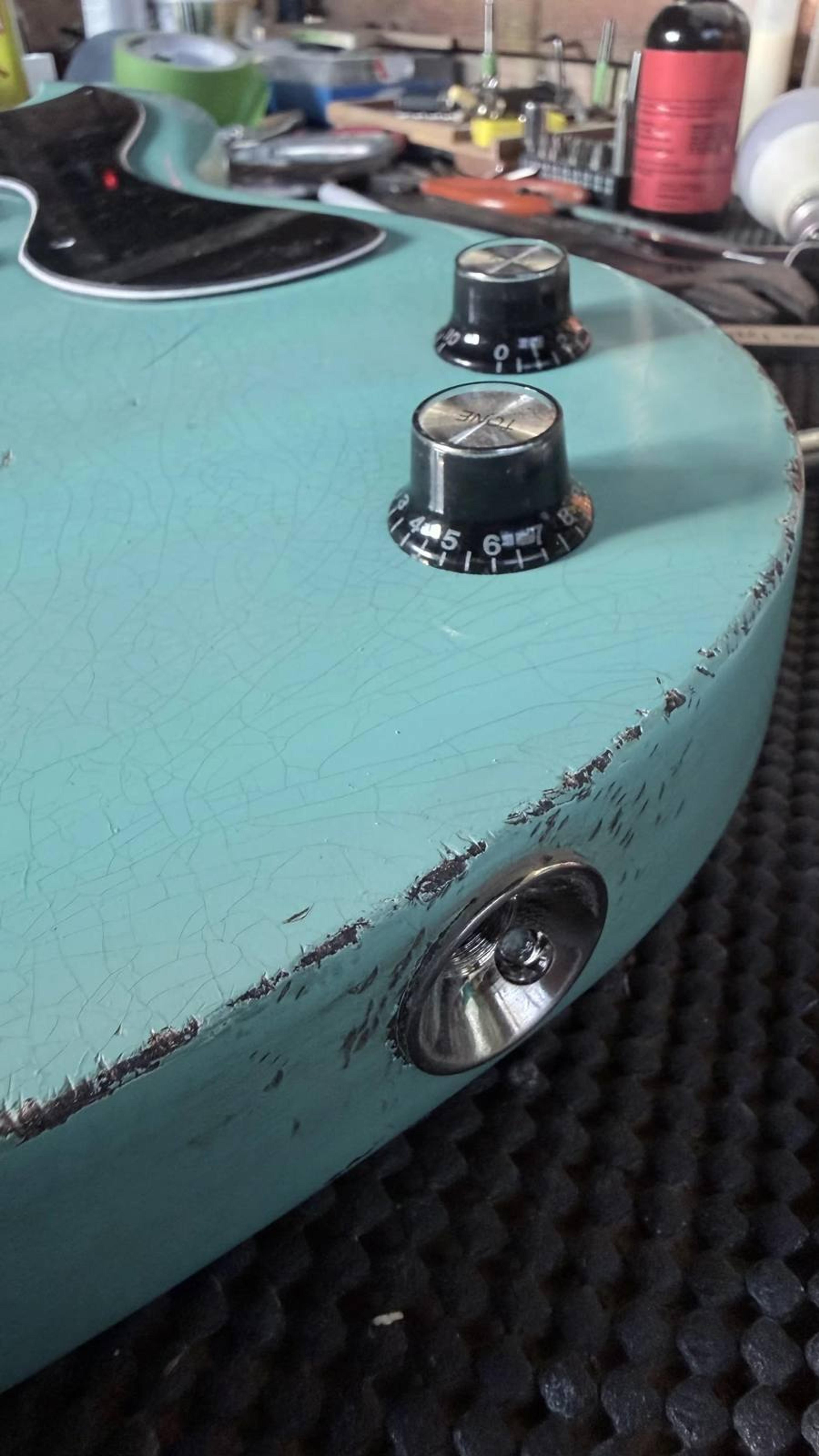 The Kid - SG Jnr style double cut - set neck - relic surf green with Tort celluloid acetate hand cut pickguard - Thomas Nilsen Dog Ear P90 - jack detail