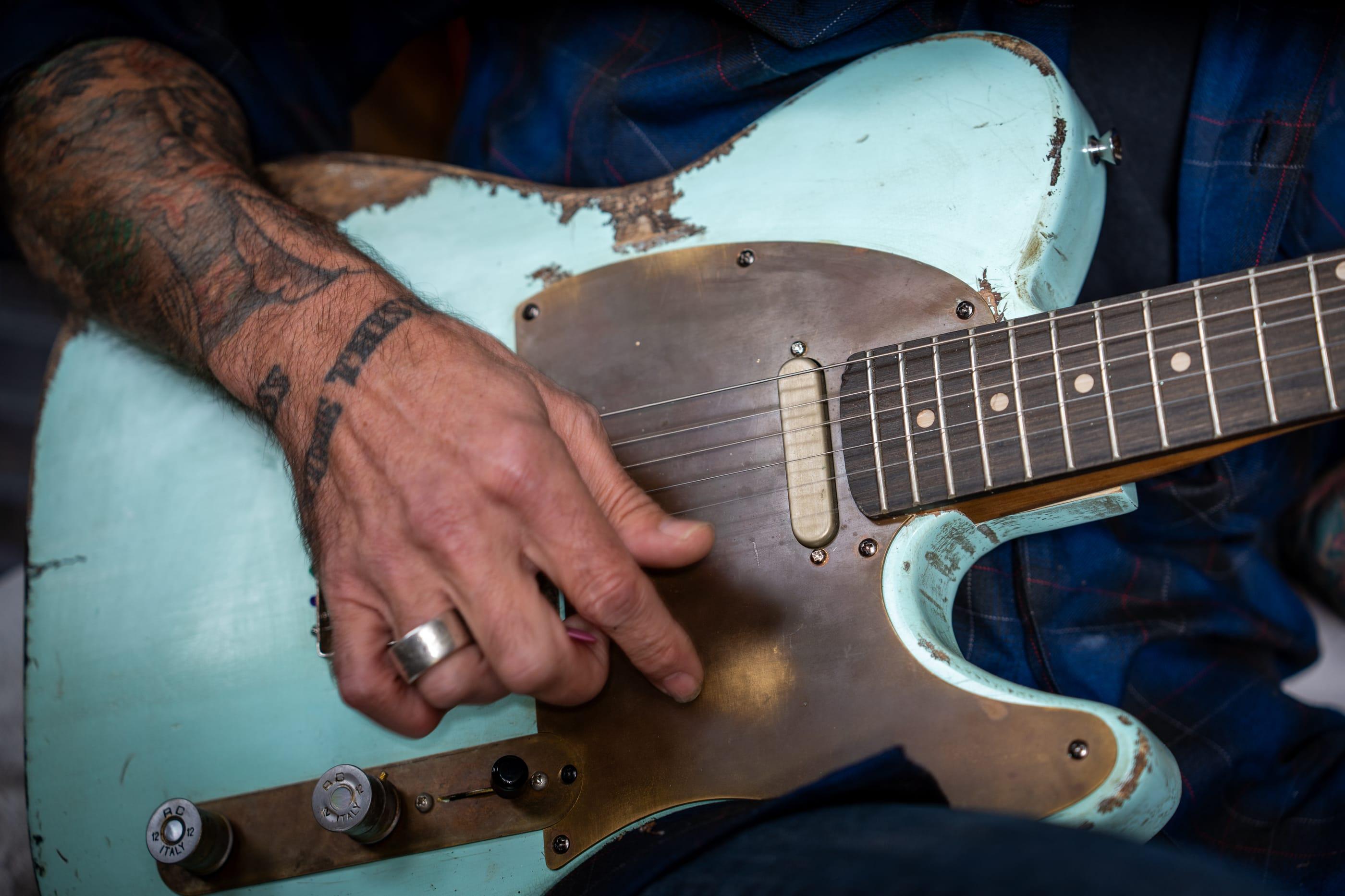John playing the Runaway by the shed window