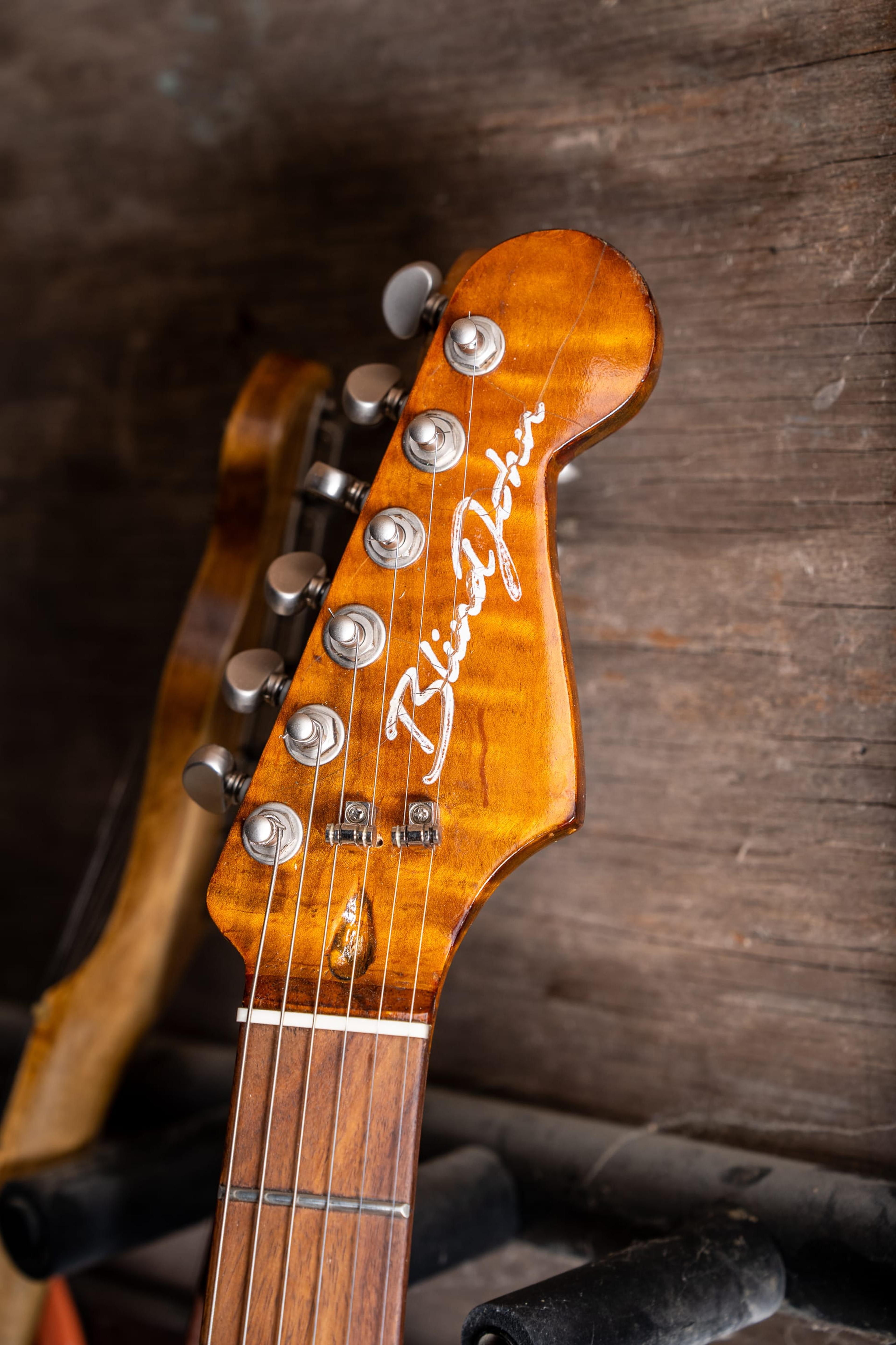 The DeVille's flame maple headstock, front