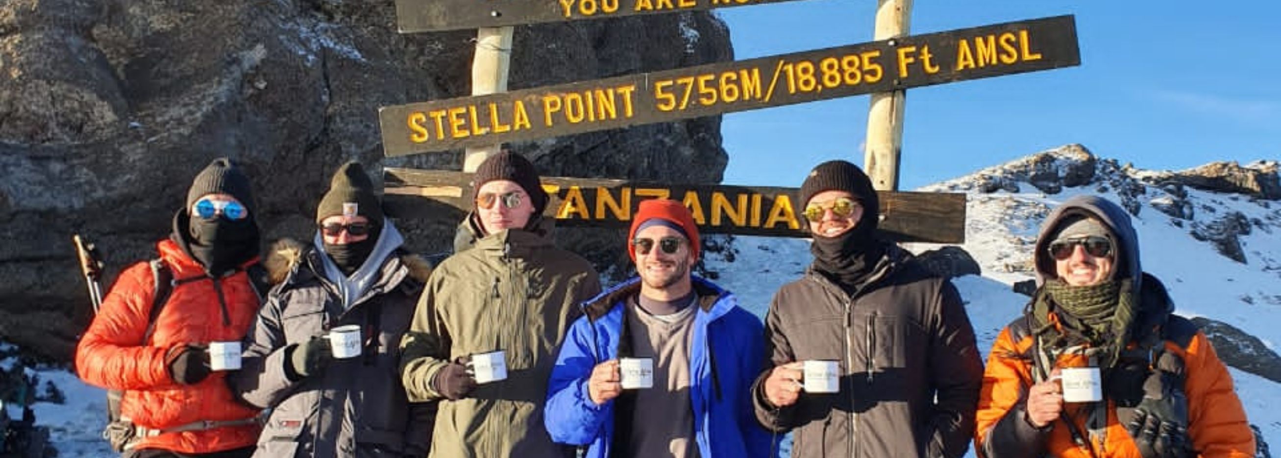 Adventurers at the peak of Kilimanjaro
