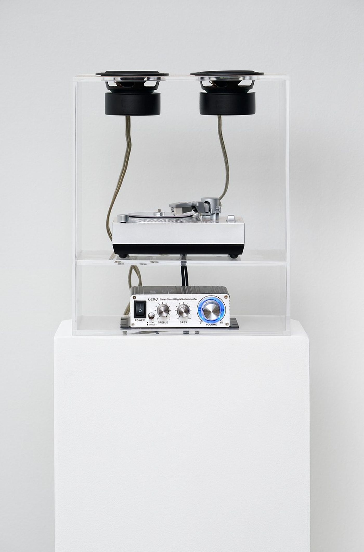 Image of LOCKED LUNGS (2 of 3), 2021: Clear acrylic 4" locked groove record, WiMi EC008B record player, speakers, amp