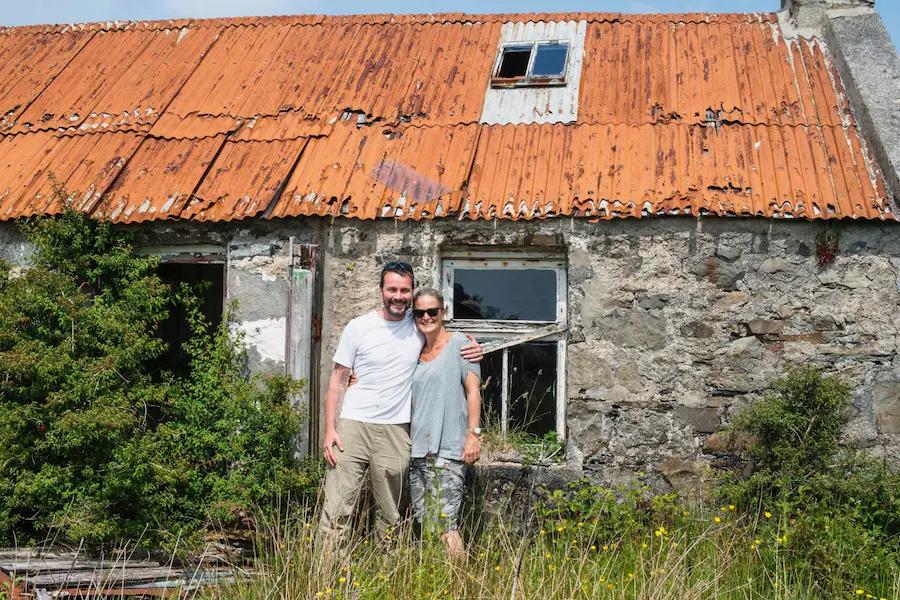 Pi and Lynton outside the roofless ruin of Mrs Leonard's Cottage at Knockrome, Isle of Jura, in 2018, before the rebuild
