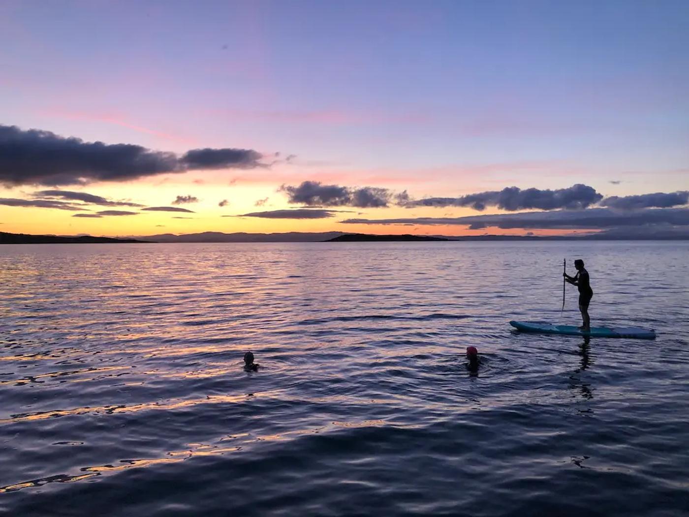 Dawn swimrise wild swim on Jura