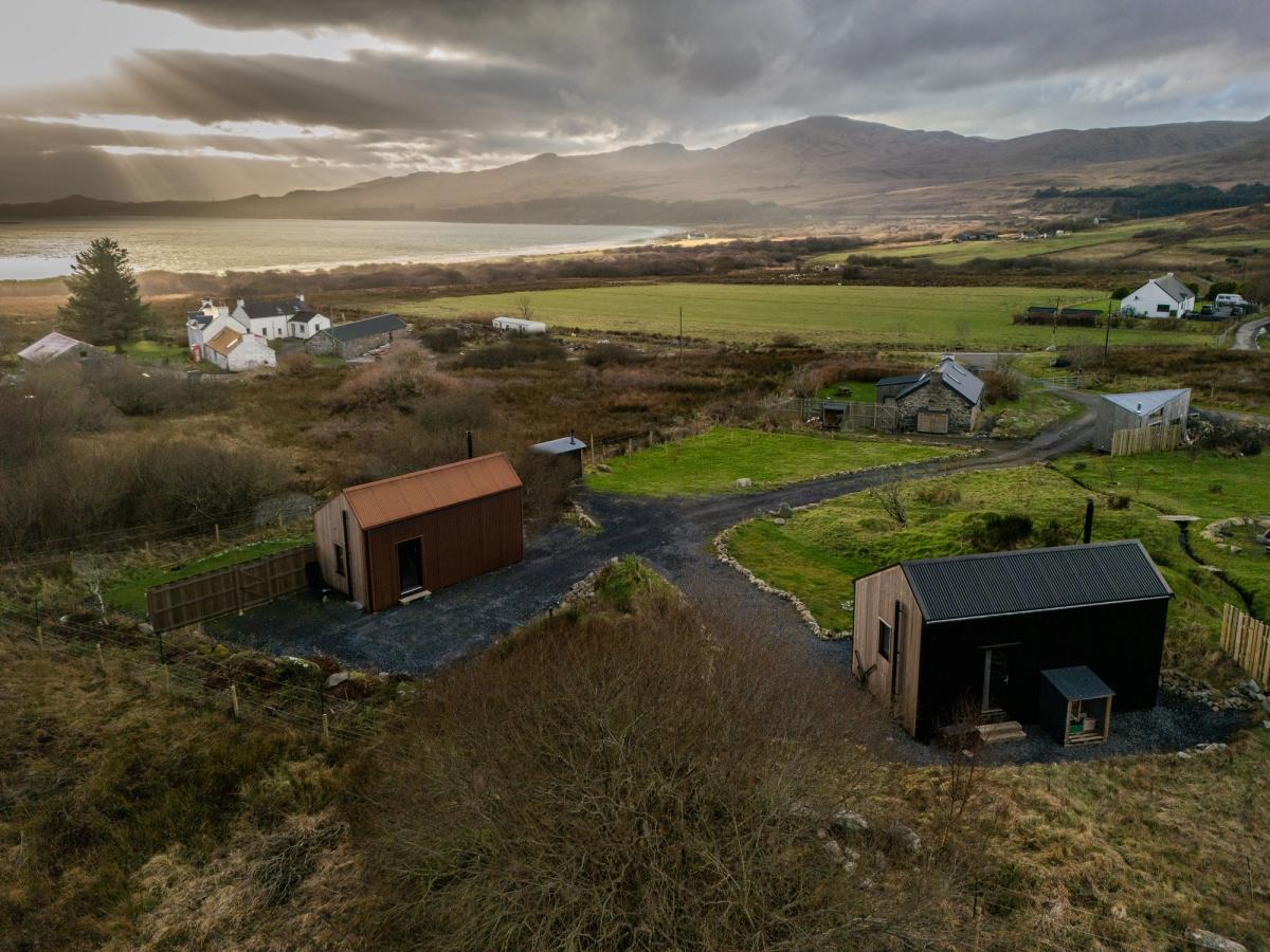 The Black, Rusty and Shepherd's huts above Corran Sands in winter