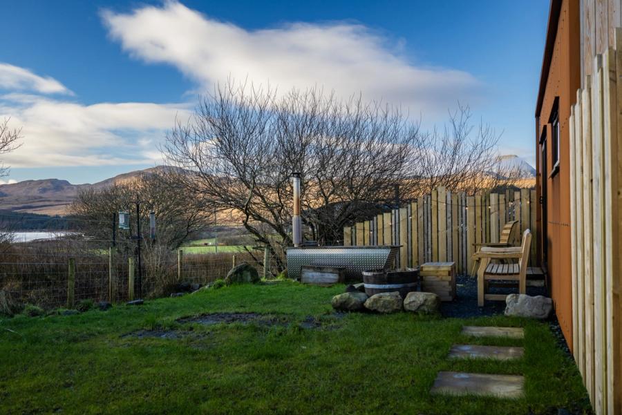 The wood-fired hot tub in the enclosed garden at The Rusty Hut, Isle of Jura