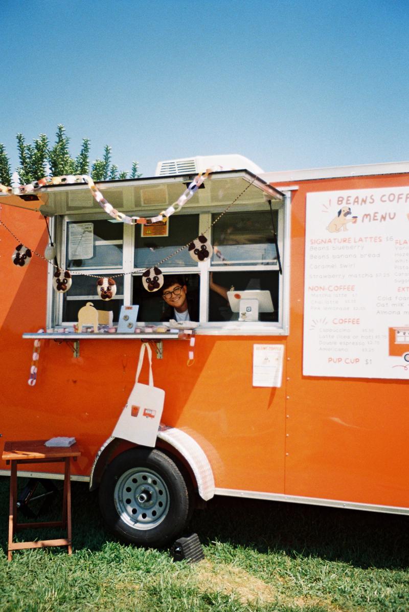 Brian inside of the Beans Coffee trailer