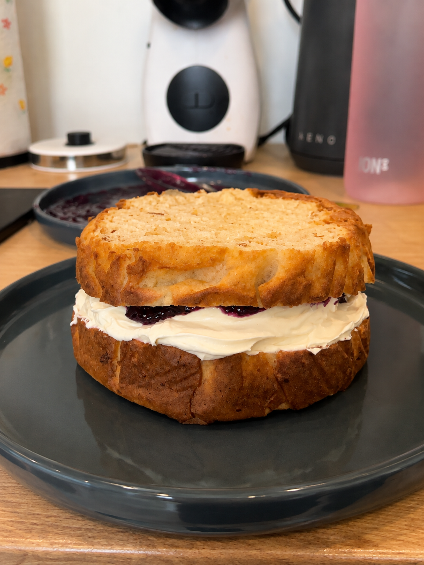 Sugar-free first birthday cake layered with blueberry filling and cream cheese frosting