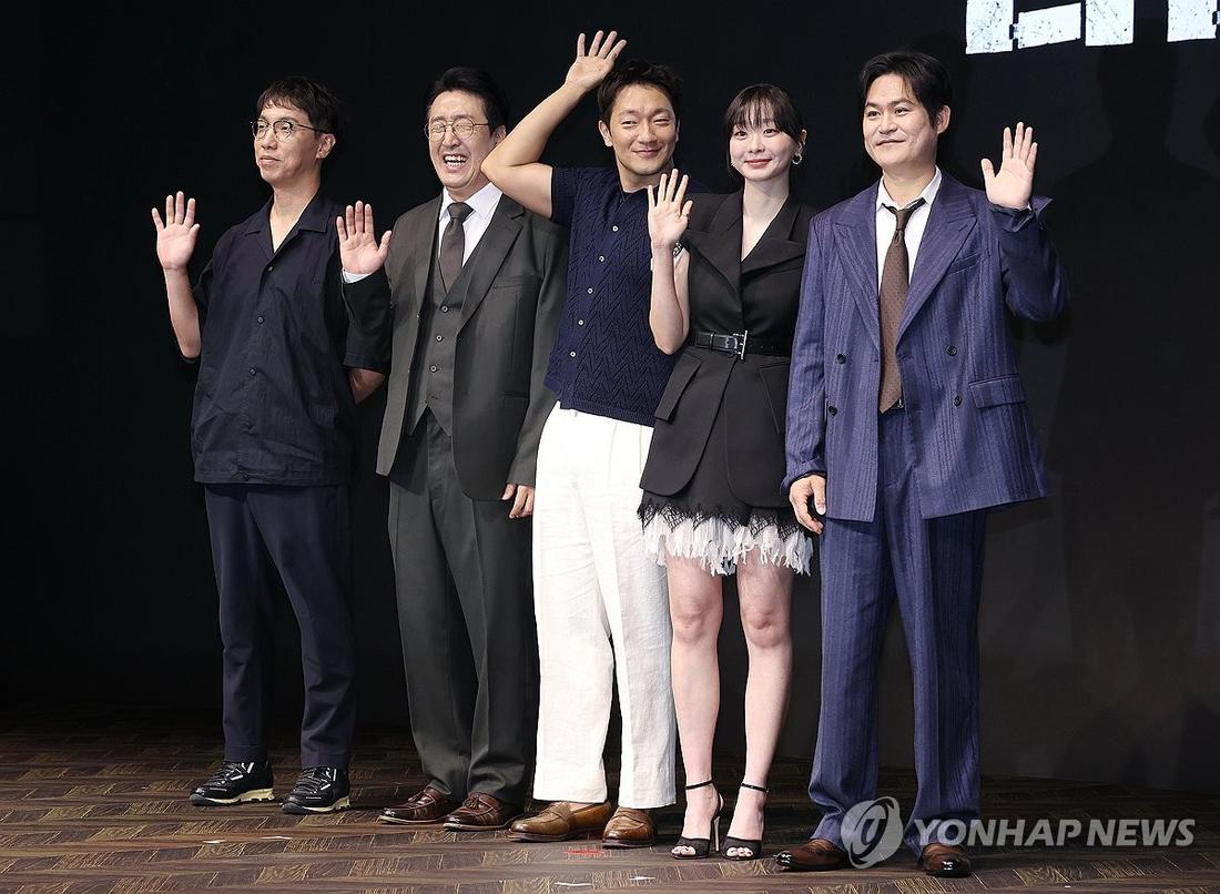 The director and cast of Disney+’s new Korean original series “Nine Puzzles” pose for a photo during a press conference at a Seoul hotel on May 14, 2025. (Yonhap)