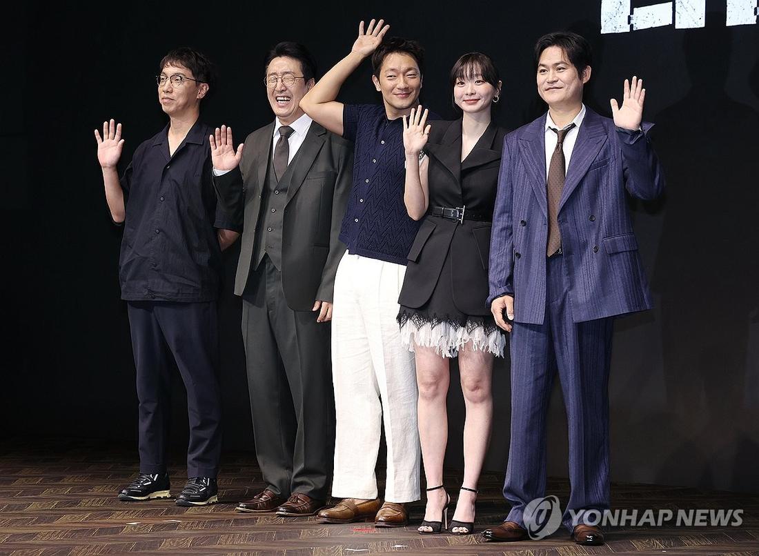 The director and cast of Disney+’s new Korean original series “Nine Puzzles” pose for a photo during a press conference at a Seoul hotel on May 14, 2025. (Yonhap)