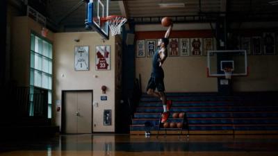 Player dunking a basketball