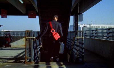 A person descends a staircase carrying an Ashya bag