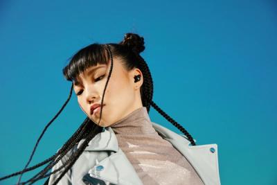 Person wearing Beats earbuds