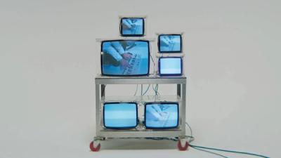 juxtaposition of analog televisions