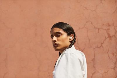 Person wearing Beats ear buds