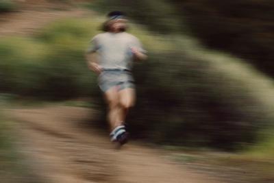 blurry runner on a trail