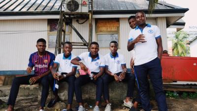 Players sitting and looking at camera