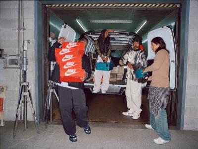 group of people unloading a van