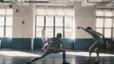Two fencers joust with each other