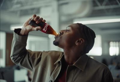 person drinking Coca-Cola