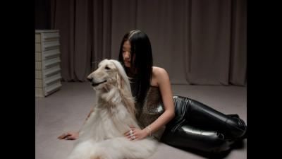 Woman on rug with dog