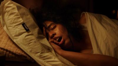 A woman sleeps with her face smashed into the pillow