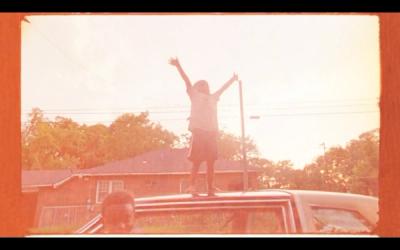 portrait on roof of car