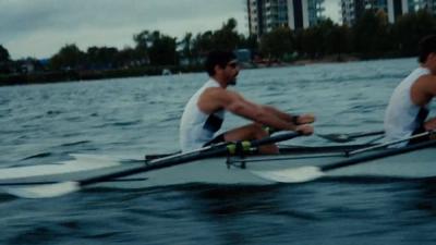 students rowing boat