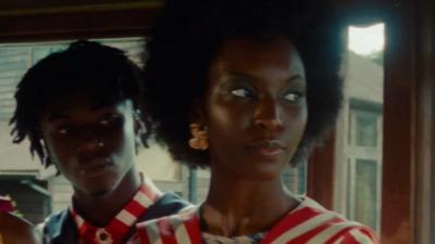 Young people hang out at a lake house in House of Aama clothing