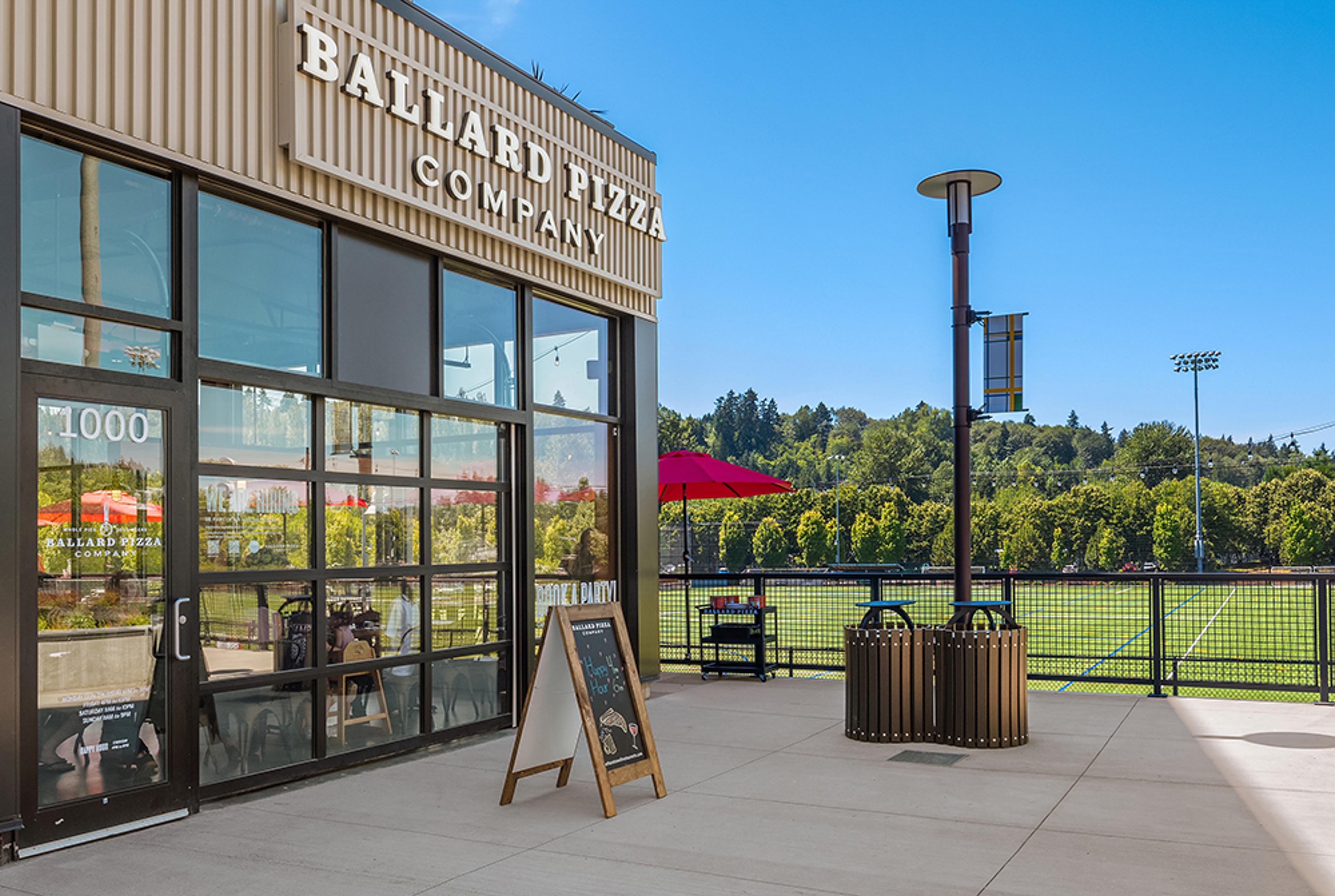 business front with large ballard pizza company sign