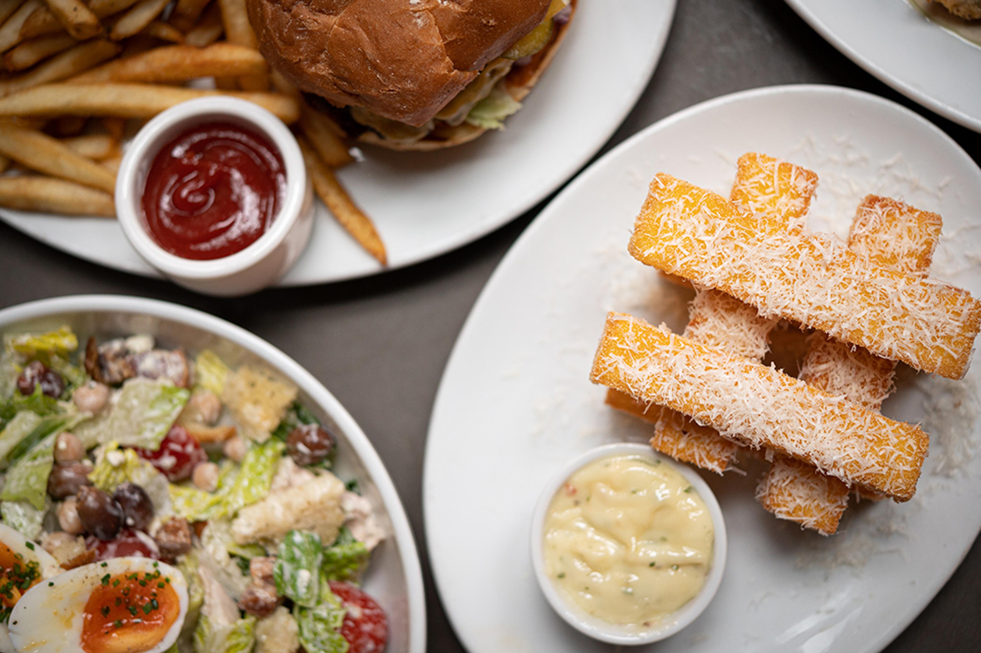 chickpea fritters, chop salad, and burger