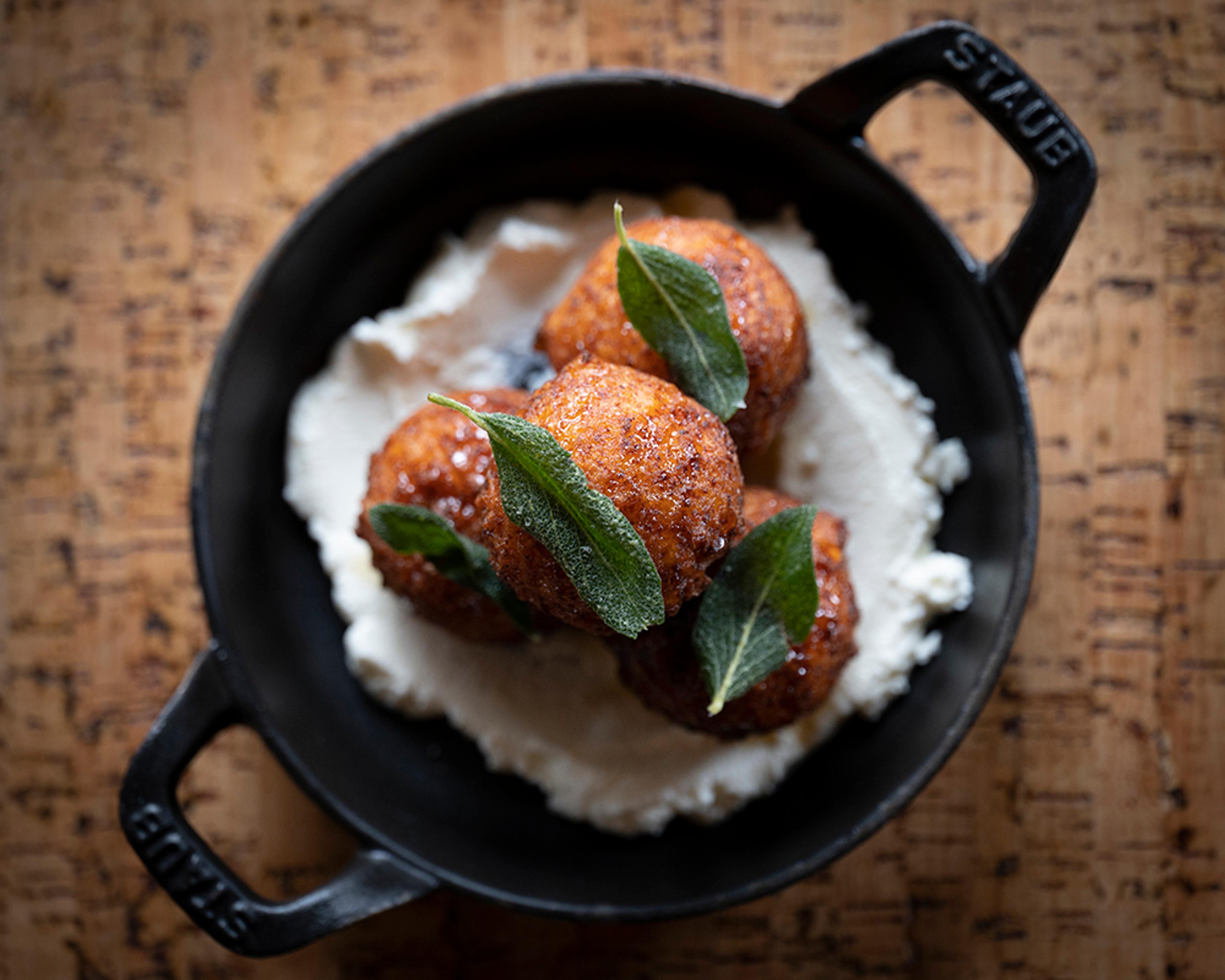 semolina fritters over ricotta topped with fried sage