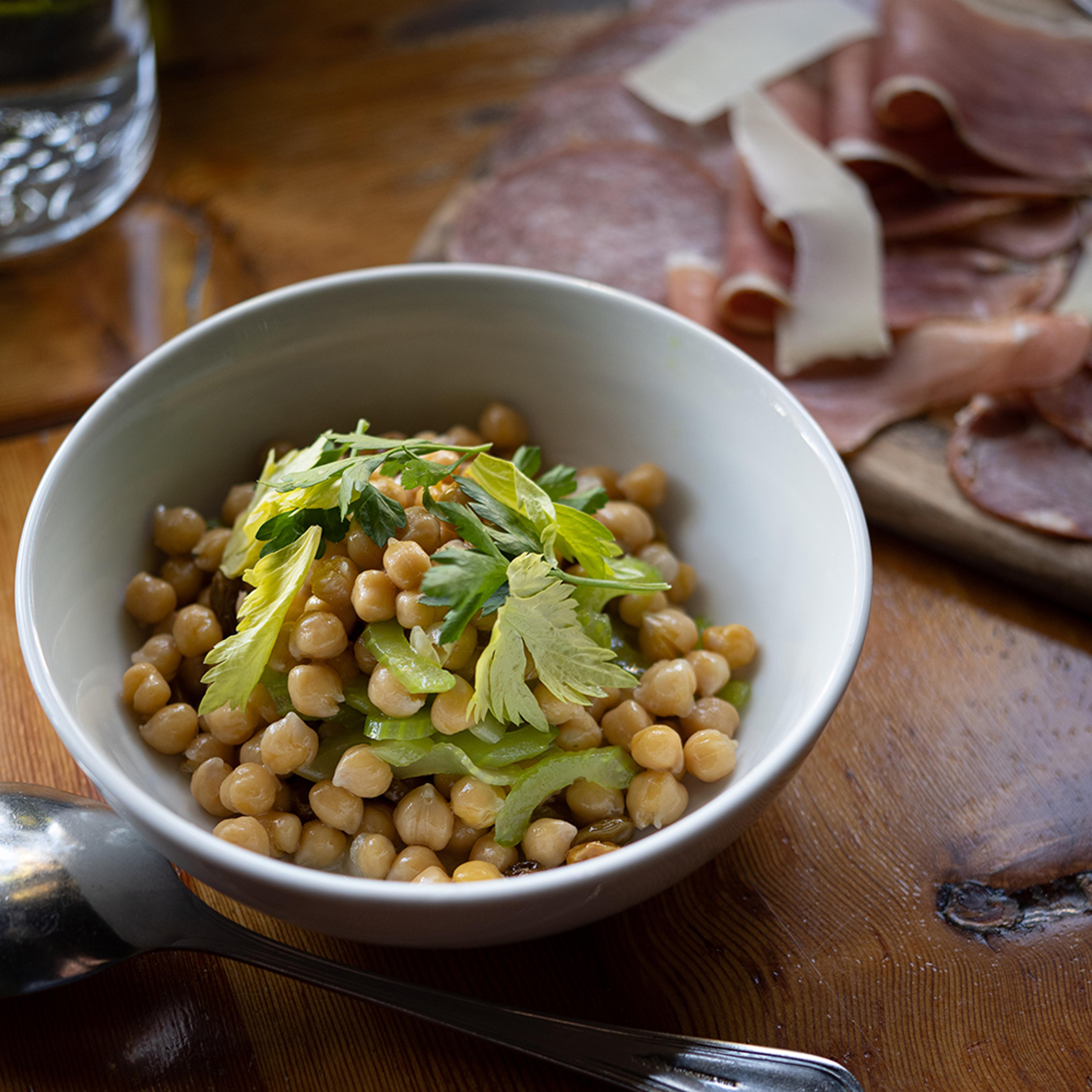 Chickpea salad with celery leaf, sultana raisins, olive oil and lemon