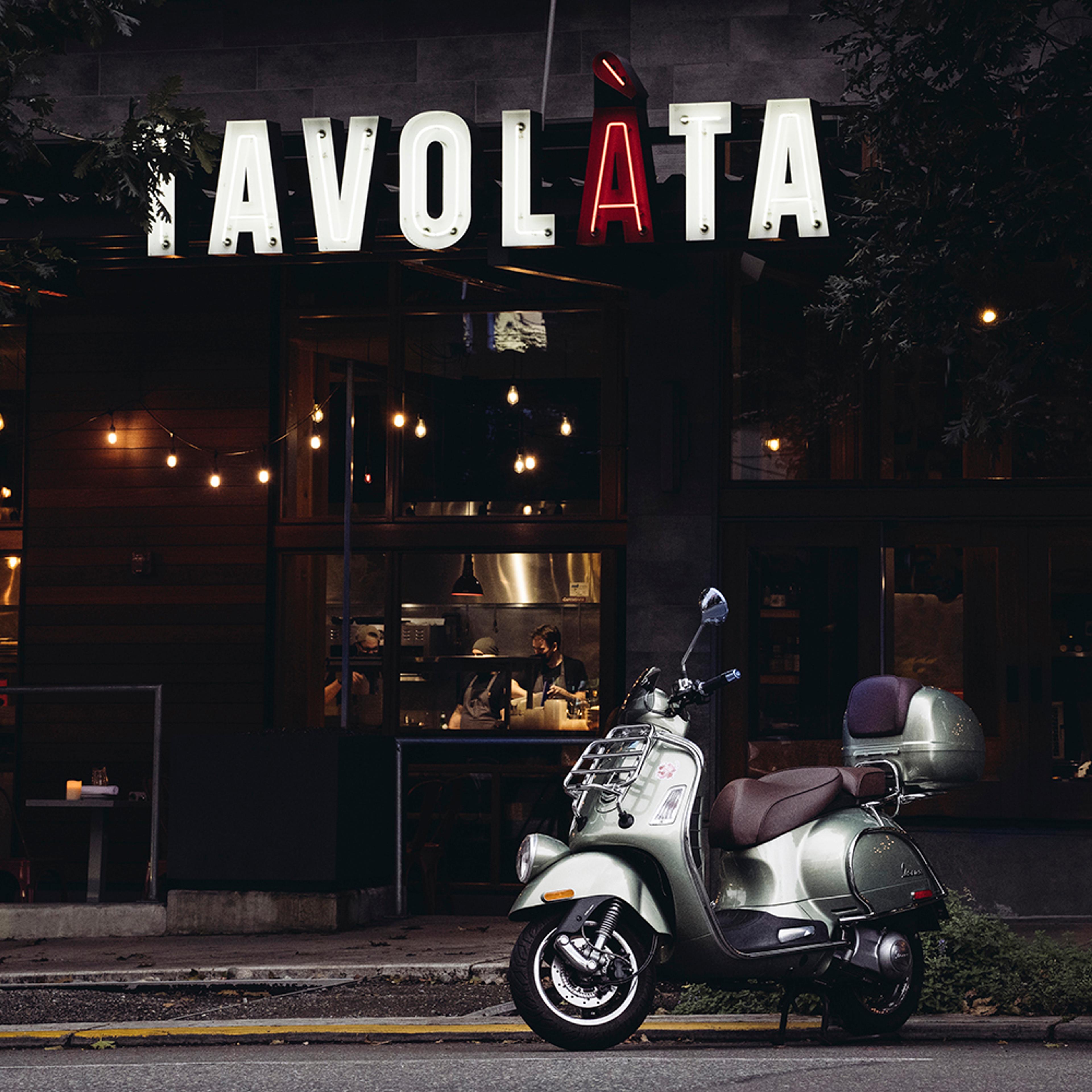 Vespa parked in front of Tavolàta restaurant