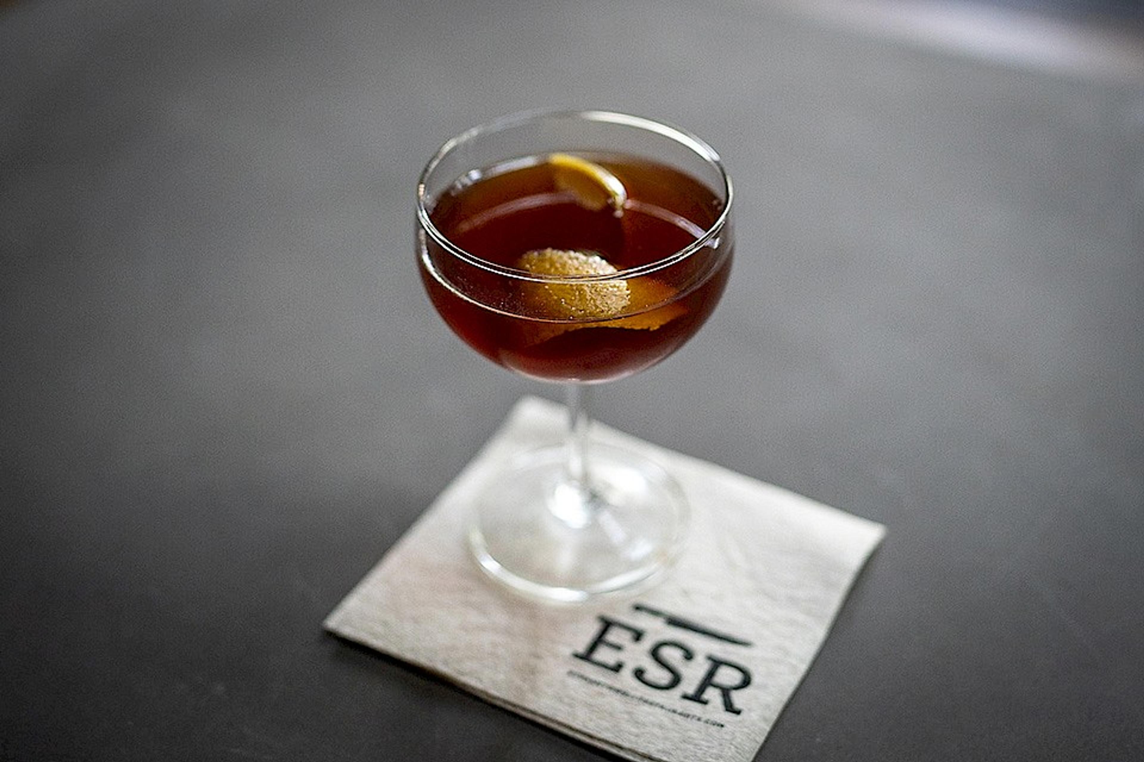 whiskey cocktail on an ESR napkin and stone table