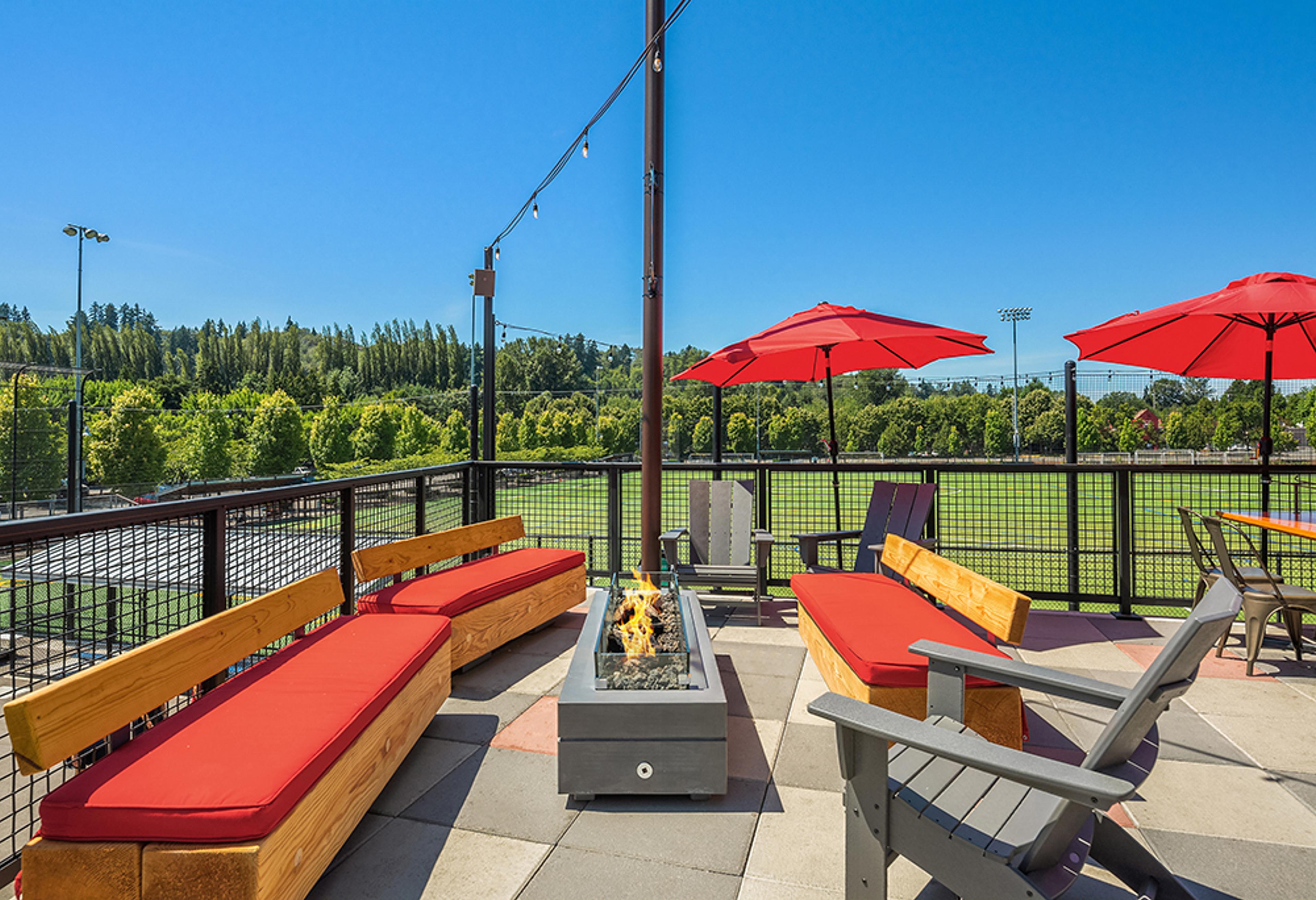 outdoor patio with fire pit and lounge couches