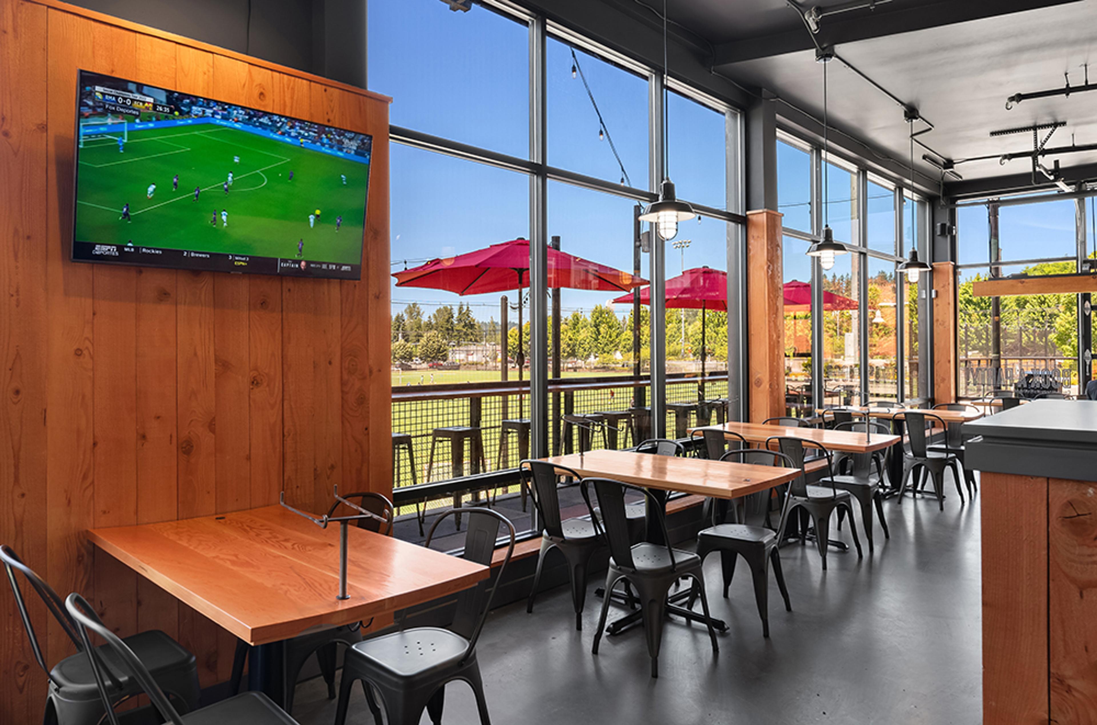 dining room with TVs featuring sports