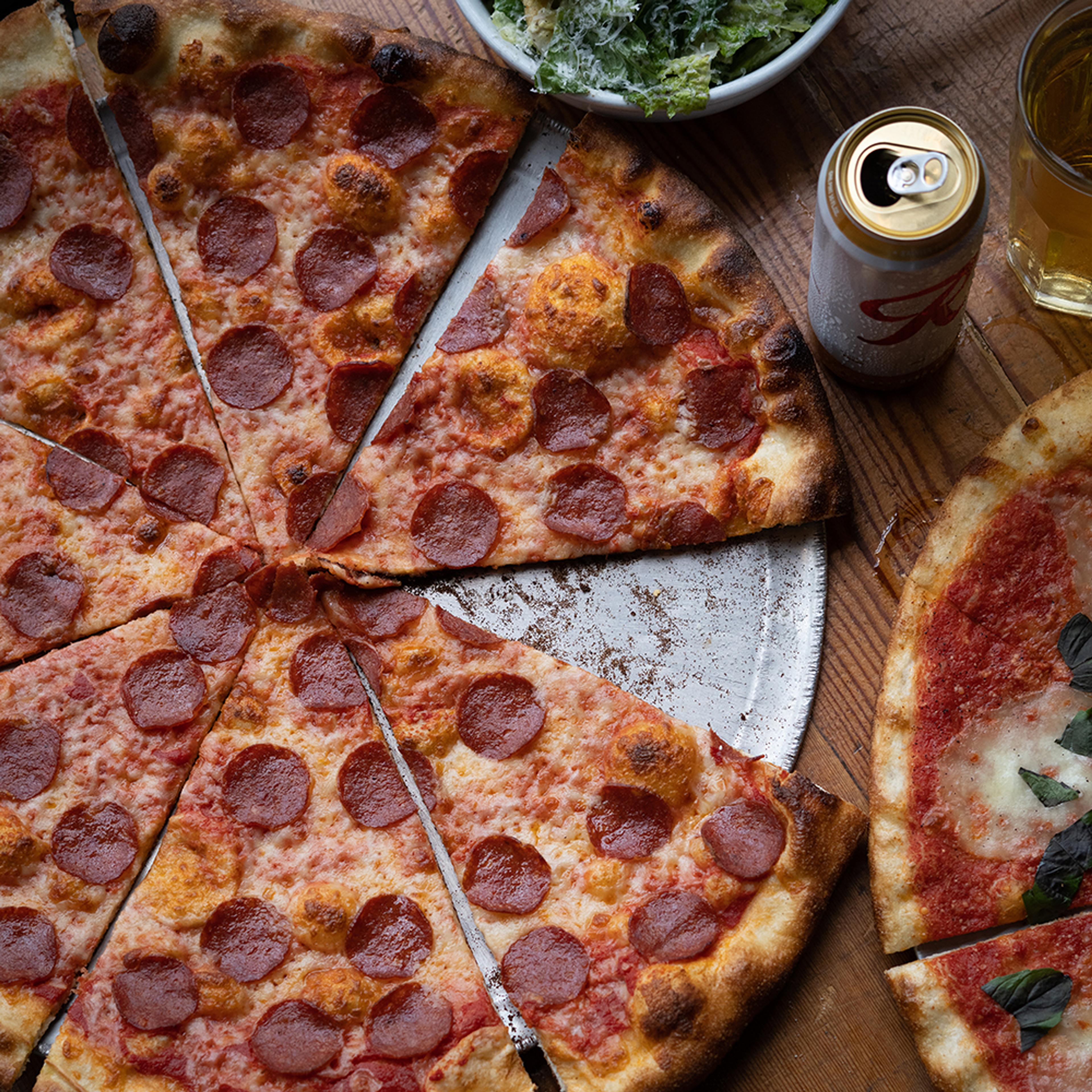 pepperoni pizza with rainier beer tallboy