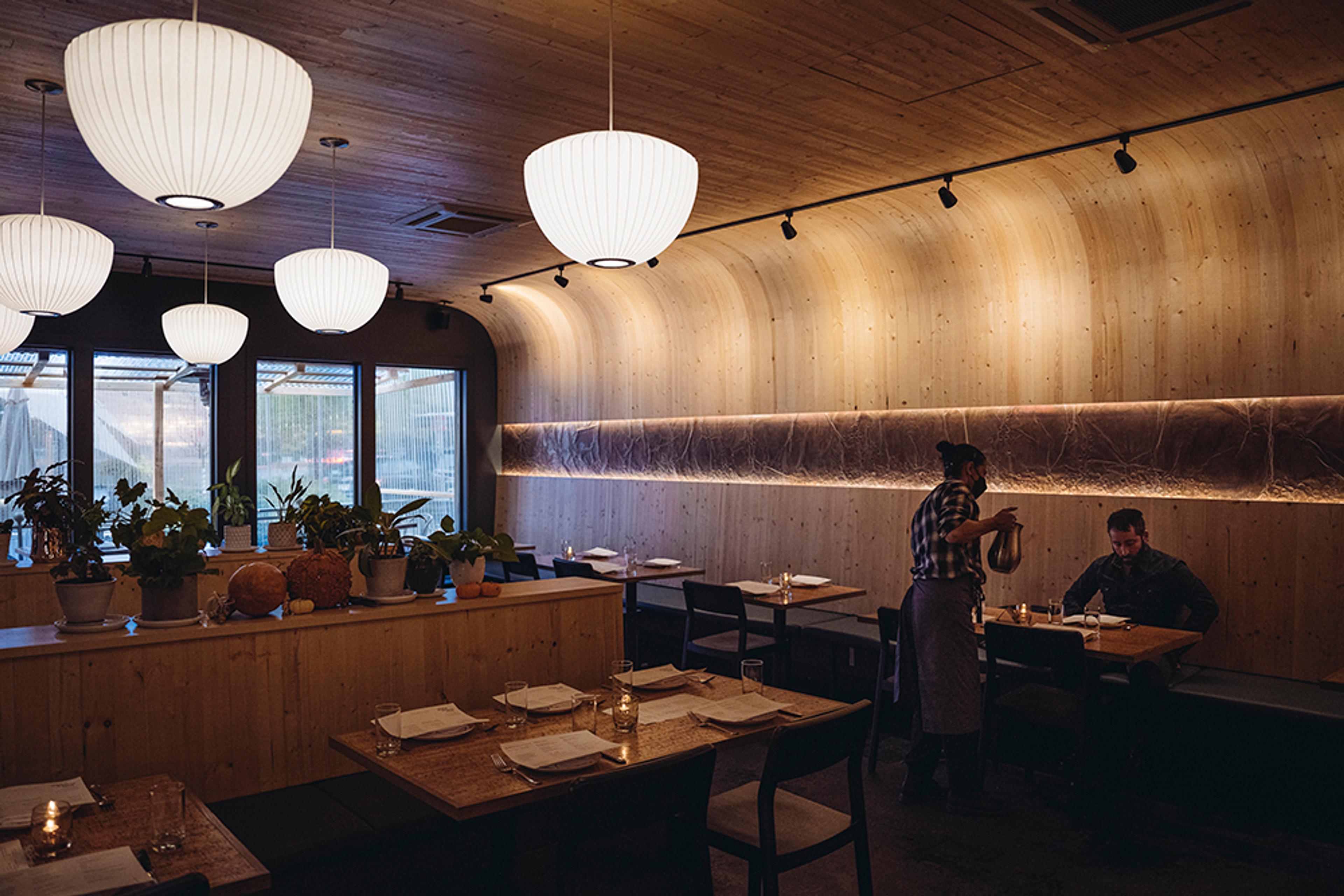 How to Cook a Wolf wood paneled interior dining area