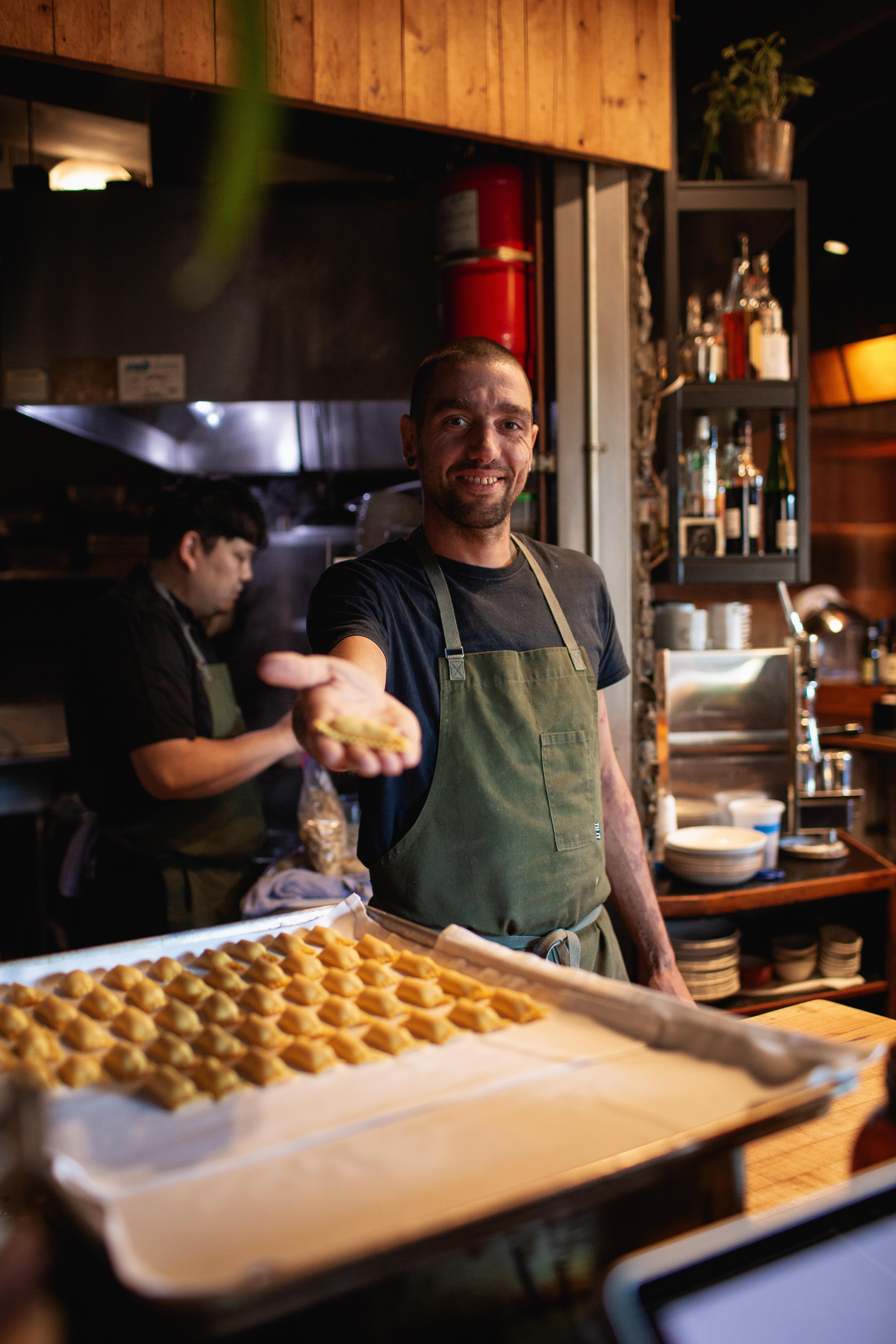 Chef holding up a stuffed pasta